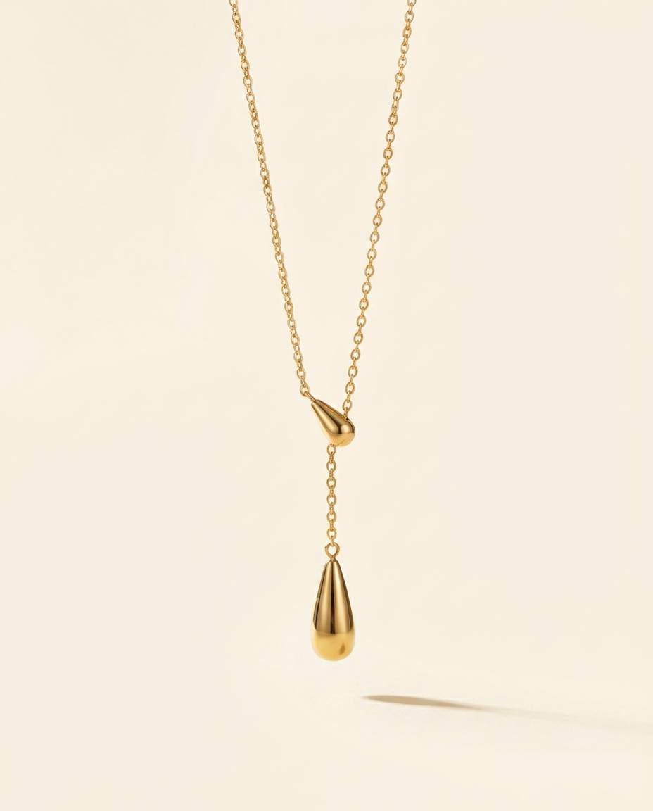 Aurora necklace with two gold-tone teardrop pendants in a Y-drop