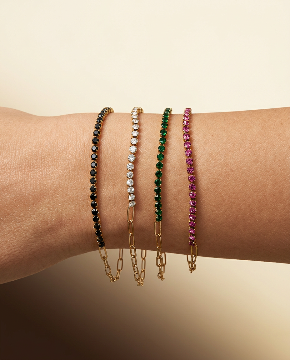 Seraphina tennis bracelets with black, clear, green and pink stones worn on the wrist
